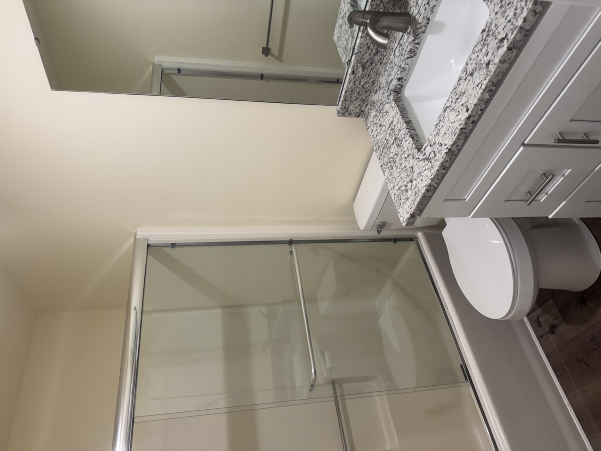 Bathroom with granite vanity and tub/shower