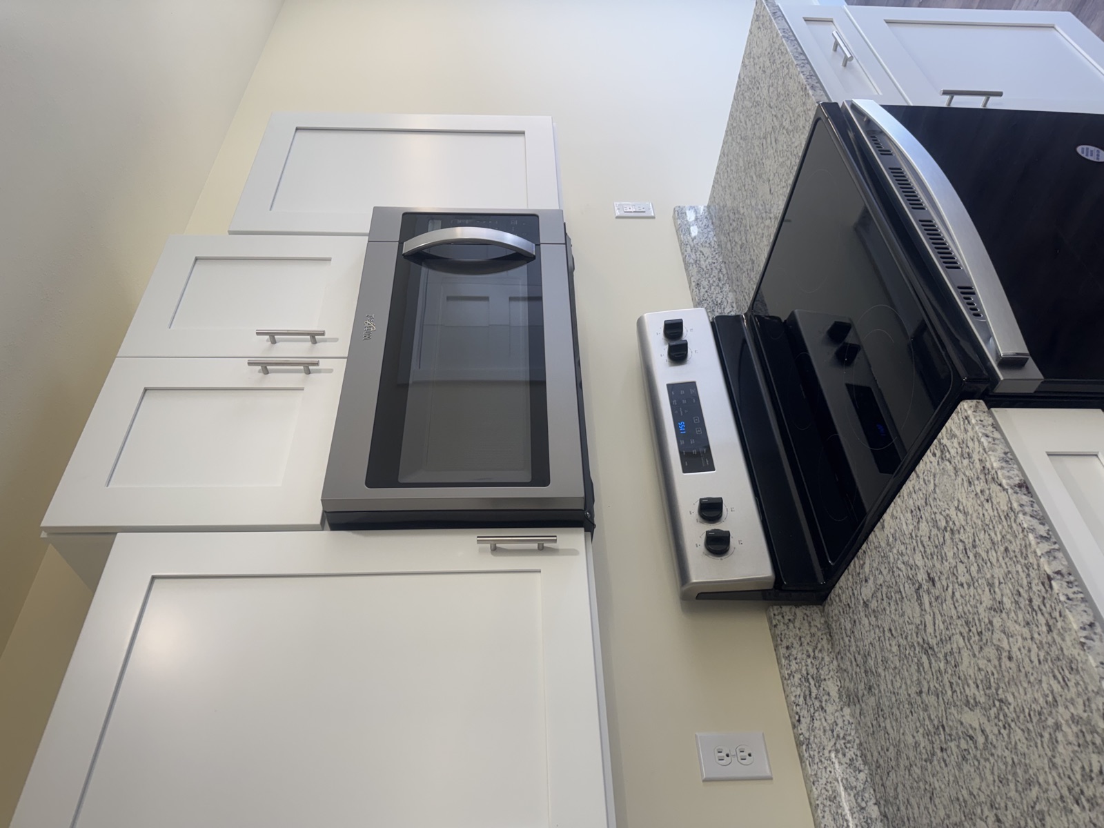 Kitchen with white shaker cabinets, granite countertops, and stainless appliances at Southwinds Trails